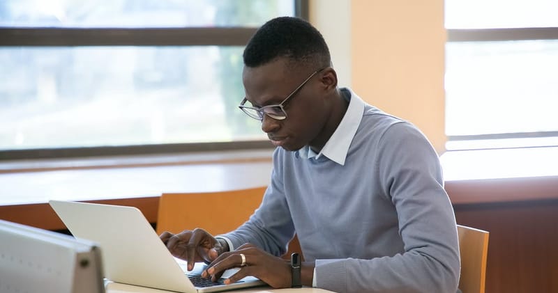 Young Man Working on a Computer