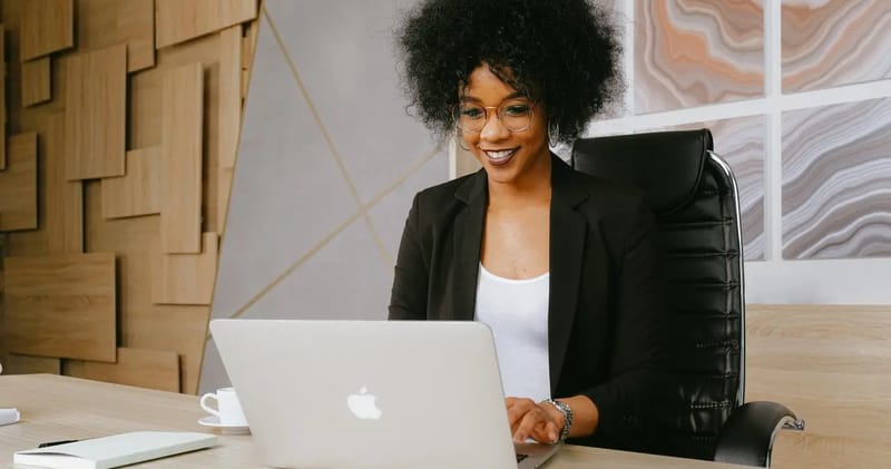 Woman Sitting at Computer Typing