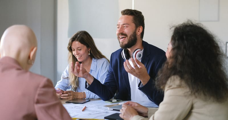 Group of cheerful businesspeople discussing strategy