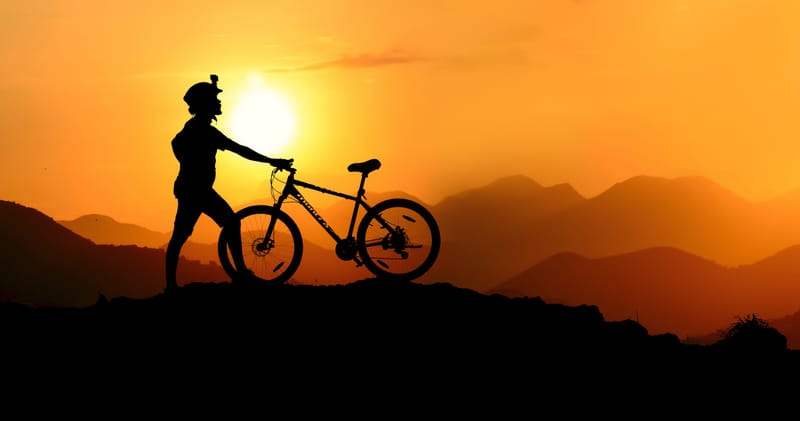 Silhouette Photography of Biker on Top of Hill