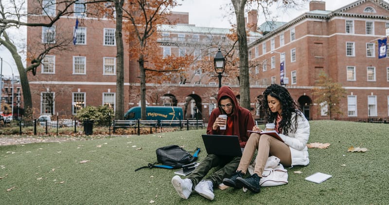 Man and Woman Studying at a Park
